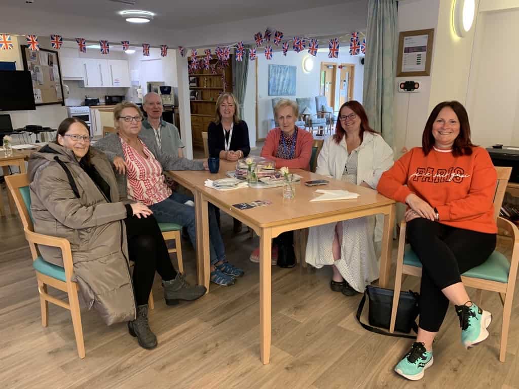 Members of Elephant Cafe sat in day unit at hospice