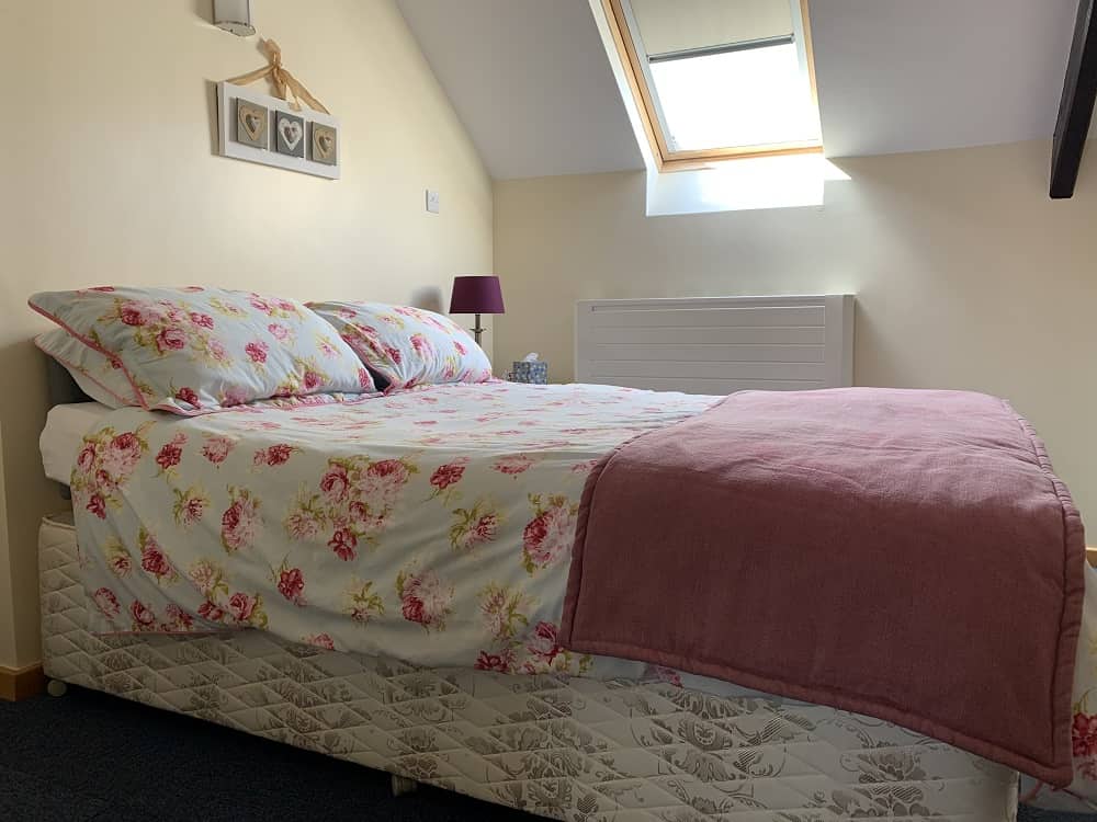 Bed in the Holly Bush flat where family and friends can stay