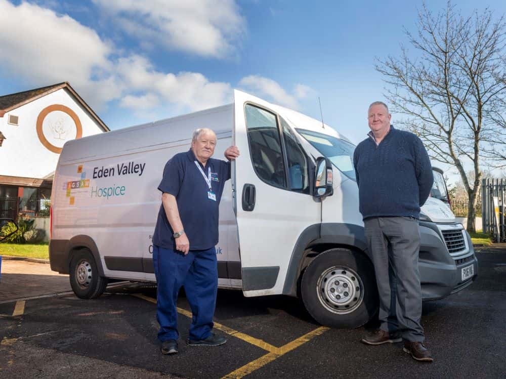 Richard and Bob posing by the retail van