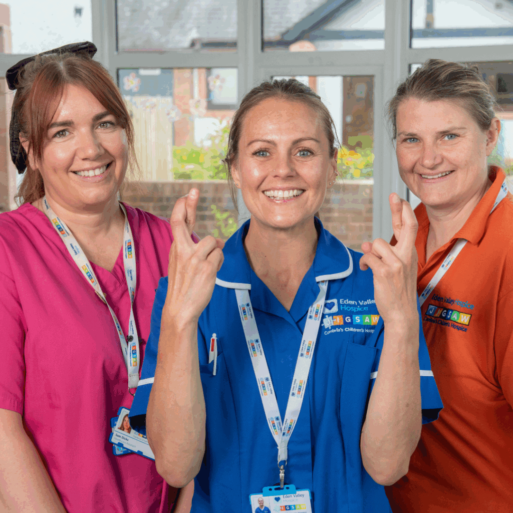 Nurses with their fingers crossed.
